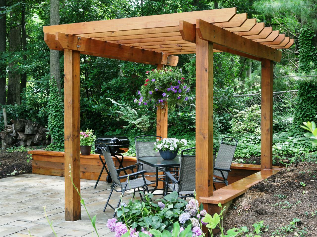 A Pergola in Western Red Cedar while Incorporting the Retaining wall as Benches! 