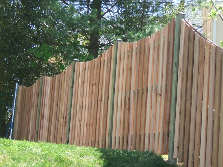 Western Red Cedar Alternating Board Fence with Black Vinyl Post Caps and dips added.