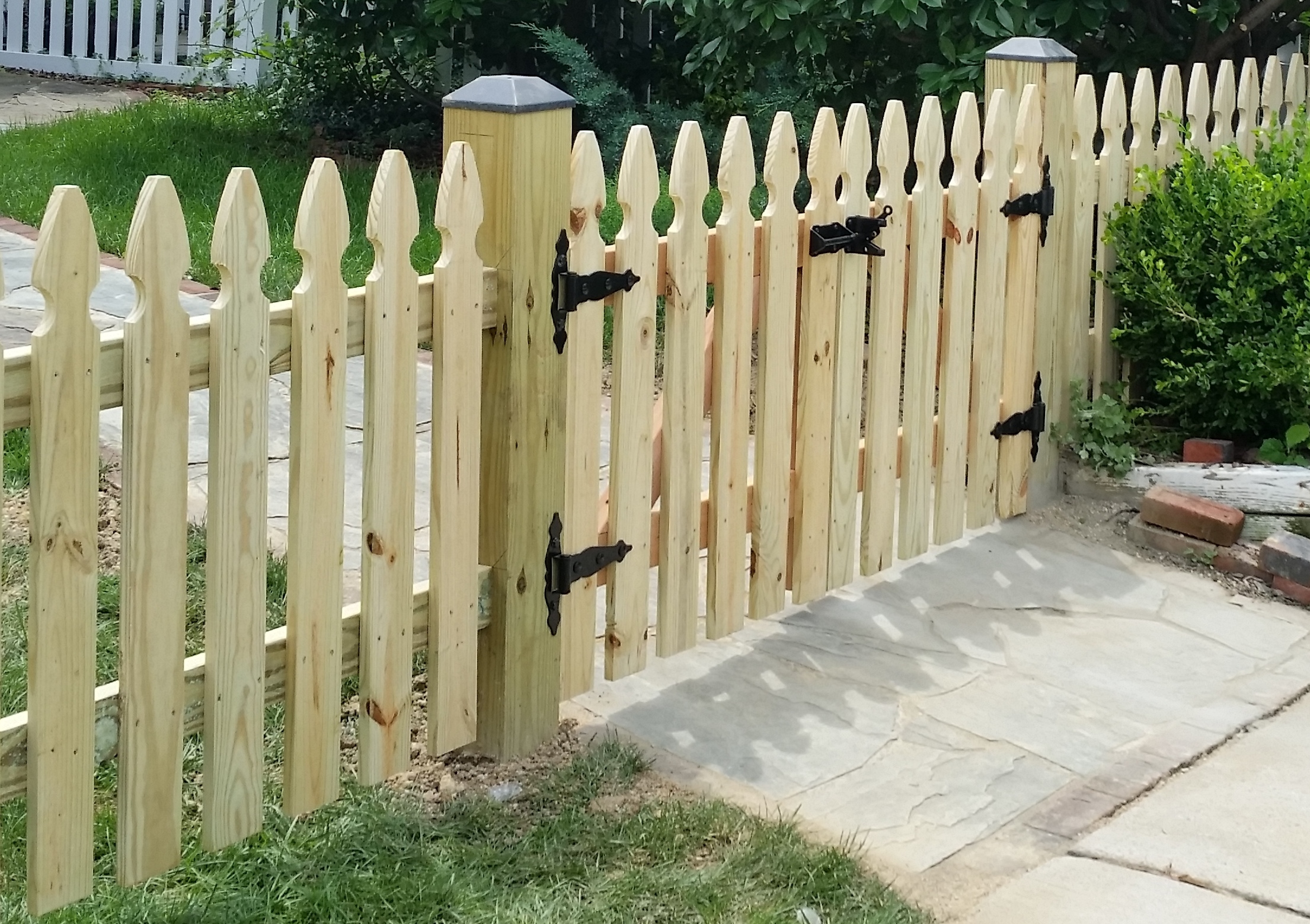 Pressure Treated Wood with Black Vinyl Post Caps and Double Gate