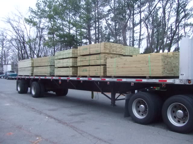 truckload of pine fence material